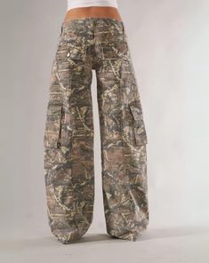 Embrace the call of adventure with our Camo Cargo Pants. Combining outdoor durability with urban style, these pants are perfect for any setting. Featuring a camo pattern and ample pocket space, you'll be ready for anything the day brings. Stay comfortable and stylish on all your journeys. Features: Wide Size Range High-Quality Material Multiple Utility Pockets Enhanced Construction Comfortable Fit Camouflage Design Durable Fabric Versatile Aesthetic Size Chart (inches): Size Waist Hip Length S 2 Low Rise Camo Cargo Pants, Camo Shorts Women, Pants You Need, Streetwear Accessories Women, Streetwear Fashion Women Street Styles, Camo Fits, Camo Jorts, All Black Outfit Ideas, Camp Pants