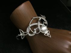 I will fabricate this complete romantic and Renaissance, boho inspired bridal set, in sterling silver, with a feminine and Celtic take on some Irish classic designs! I make everything in sterling silver, at my bench studio, and each piece is forged and fabricated one-at-a-time, by my hand only...nothing is pre-manufactured or made elsewhere! So, because of this, please allow me proper time to complete the set and ship in plenty of time for hair trials, etc. as I want to ensure I am not rushed an Elegant Moonstone Jewelry For Festivals, Silver Moonstone Jewelry For Festival, Artisan Adjustable Wedding Jewelry, Artisan Adjustable Jewelry For Wedding, Spiritual Sterling Silver Bracelet For Weddings, Handmade Sterling Silver Bracelet For Wedding, Handmade Sterling Silver Round Bracelet For Wedding, Bohemian Silver Jewelry For Wedding, Unique Silver Bracelets For Wedding