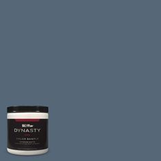 a can of dymasty paint on a gray background