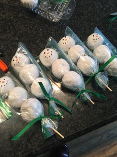 snowman marshmallows wrapped in plastic and tied with green ribbon