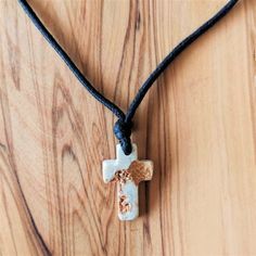 Handmade stone cross pendant necklace for men, women or kids.Cord can be adjusted so it fits grown ups and kids a like.Pendant handcrafted out of stone from Medjugorje Apparition hill, shaped in to cross.Can be ordered in 2 sizes: 1.8 cm and 2.5 cm / .7" and 1.1".Gift yourself and your loved ones with this special item.Can be ordered in large numbers and be used as a gift in weddings or other occasions. Contact us for discount on bigger orders. Message card of Holy Lady from Medjugorje included. Spiritual Cross Jewelry With Adjustable Cord, Adjustable Cross Pendant Necklace As Gift, Adjustable Pendant Cross Necklace Gift, Adjustable Crucifix Necklace For Gift, Artisan Crucifix Necklace For Gift, Adjustable Spiritual Cross Necklace, Handmade Adjustable Cross Pendant Necklace, Adjustable Spiritual Cross Pendant Necklace, Handmade Adjustable Crucifix Cross Necklace