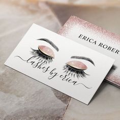 two business cards with eyelashes on them