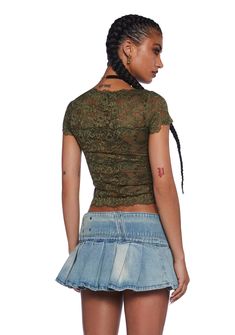 This top has a stretchy sheer lace construction, a small velvet bow applique in front, lace detailing, cap sleeves, and a crop fit. Fitted Lace Patchwork Top With Short Sleeves, Stretch Lace Patchwork Short Sleeve Tops, Stretch Short Sleeve Tops With Lace Patchwork, Fitted Lace Top With Short Sleeves For Night Out, Fitted Short Sleeve Lace Top For Night Out, Casual Green Lace Top, Casual Lace Crop Top With Short Sleeves, Green Lace Party Top, Green Lace Trim Top For Party