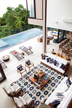 an aerial view of a living room with couches, chairs and coffee table in it