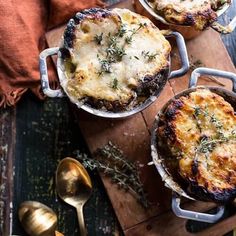 three pot pies sitting on top of a wooden cutting board