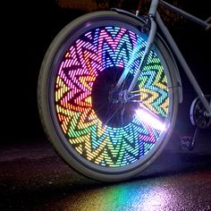 a bicycle wheel with colorful lights on it