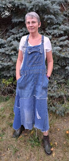 Fabulous refashioned denim bib dress. Lots of different jeans went into the piecing of this denim jumper. Frayed seams and uneven hemline add to the upcycled look. Nice deep pockets and adjustable shoulder straps. Wear it with a t-shirt or over a chunky sweater, this is a all season outfit. Fits up to a 42" waist, about 30" from waist to hem machine wash and dry Denim Bib Dress, Turning Overalls Into A Dress, Upcycle Overalls, Dark Wash Denim Dress With Patchwork, Upcycled Overall Dress, Vintage Denim Blue Bib Front Overalls, Bib Dress, Denim Jumper, Bib Overalls