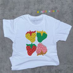 This Stages Of Strawberry Tee is a cottagecore shirt that was inspired by kidcore shirt and kidcore clothes. With eye catching colors - this strawberry shirt will surely be a great staple for your cottagecore aesthetic or kidcore aesthetic wardrobe. It can be a cute gift for her, cute gift for him or anyone in between as this strawberry printed shirts are unisex. Available in Sizes XS, S, M, L, XL, 2XL and 3XL. *Order the next size or size after next for oversized shirt comfy look. ✨ MilkDesigns Original ✨ 100% ⭐️ PREMIUM ⭐️ Airlume combed and ringspun cotton  ✨ Light fabric ✨ Retail Unisex fit ✨ Tear away label ✨ Runs true to size ‼️ Print Size will scale up or down depending on the shirt size to keep the integrity of the print. *Sustainability Commitment: All of our products are made onl Cute Multicolor Printed Shirt, Playful White Tops With Strawberry Print, White Cotton Shirt With Fruit Print, Cute Multicolor Screen Print Shirt, Kidcore Shirt, Kidcore Clothes, Kidcore Clothing, Aesthetic Wardrobe, Y2k Shirts