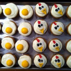 cupcakes decorated with white frosting and chicken faces