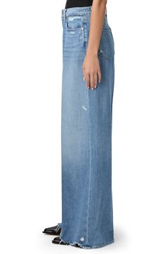 Made from supersoft and drapey denim, these vintage-inspired jeans feature the brand's highest waist and widest, longest legs to create a dramatic silhouette. 34 1/2" inseam; 28 1/2" leg opening; 12" front rise Zip fly with button closure Five-pocket style 60% cotton, 40% lyocell Machine wash, tumble dry Imported Classic Washed Blue Wide Leg Flare Jeans, Classic Wide Leg Washed Blue Flare Jeans, Washed Blue Wide Leg Flare Jeans With Five Pockets, Washed Blue Wide Leg Flare Jeans, Chic Washed Blue Wide Leg Jeans, Chic Wide Leg Washed Blue Jeans, Washed Blue Wide Leg Cropped Jeans, Chic Washed Blue Wide Leg Flare Jeans, Classic Wide Leg Jeans With Frayed Hem