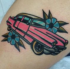 a pink car with flowers on it's side and an arrow in the back