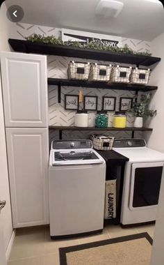 a small laundry room with white appliances and shelves above the washer and dryer