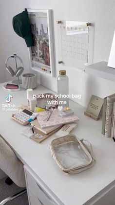 a white desk topped with lots of books