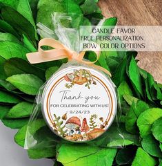 thank you for celebrating with us ornament on top of green leafy wreath