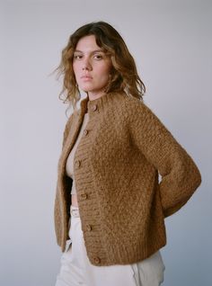 The OZMA Sweater Collection is made in Peru with the finest alpaca and wool yarns. All factories and yarn manufacturers are proudly Promperu Fair Trade Certified. The ideal slightly oversized, chunky knit cardigan — perfect for layering up when it's cold or worn alone with a favorite pair of jeans. Hand knit in the softest Caraveli yarn, with buttons up the front and a slight bell sleeve. The nature of the hand knit yarn will grow a bit with wear, so size down for your perfect fit that will last Hand Knit Cardigan, Chunky Knit Cardigan, Sweater Collection, It's Cold, Wool Yarn, Knitting Yarn, Bell Sleeve, Chunky Knit, Fair Trade