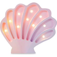 a pink light up shell shaped object with lights on it's sides and the top section