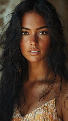 a woman with freckled hair is posing for the camera