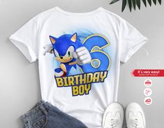 sonic the hedgehog birthday boy shirt and denim shorts with white sneakers next to it