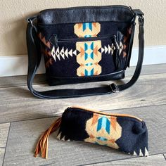 Southwest Crossbody Bag And Wallet Pouch Made With Pendleton Wool And Leather. The Dimensions Are 12x10x2. Bag Is Made With Blanket Weight Pendleton Wool In Rancho Arroyo Print And Black Leather. The Interior Is Made With Canvas And Has Interior Open And Zipper Pocket. The Bag Has A Zipper Closure With A Leather Tassel Zipper Pull. There Is A Zipper Pocket On The Back Of The Handbag With A Leather Tassel Zipper Pull. Adjustable Leather Straps, Shortest For Shoulder And Longest For Crossbody And A Matching Zipper Pouch Is Included. Excellent Preowned Condition. Smoke Free Pet Friendly Photos Are Part Of The Description Pendleton Wool, Wallet Pouch, Leather Tassel, Etsy Handmade, Handmade Bags, Zipper Pouch, Black Blue, Pet Friendly, Zipper Pocket