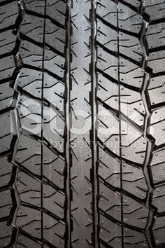 an image of a tire with water droplets on the tread and it's surface