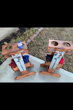 two pieces of wood sitting on top of a cement slab