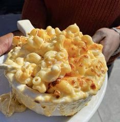 a white plate topped with macaroni and cheese