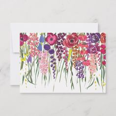 a card with watercolor flowers on the front and bottom, in pinks, purples, and greens