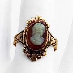 Antique Victorian 10 K (.417) rose gold ring, having ornate front with an oval form shell cameo inset, featuring carved female profile. This intricate ring is a size 7 3/4 and weighs 3.2 grams. Eb8934 Gold Cameo Signet Ring Collectible, Gold Oval Cameo Rings, Gold Signet Ring With Cameo Collectible, Antique Cameo Ring Collectible, Vintage Oval Carved Engraved Ring, Vintage Cameo Signet Ring, Victorian Oval Carved Rings, Gold Oval Cameo Signet Ring, Heirloom Oval Cameo Signet Ring