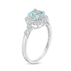 With touches of old and new, this vintage-inspired engagement ring captures her romantic style. Crafted in sterling silver, this lovely look showcases a 6.0mm cushion-cut lab-created icy-blue aquamarine wrapped in a frame of marquise and kite shapes adorned with sparkling diamonds and intricate milgrain detailing. Additional marquise shapes shimmer with petite diamonds and milgrain borders along the shank to complete this heirloom design. Captivating with 1/20 ct. t.w. of diamonds and a bright p Classic White Gold Diamond Ring With Blue Topaz, Classic Topaz Ring With Diamond Accents For Anniversary, Timeless Birthstone Ring With Accent Stones For Anniversary, Classic Topaz Ring With Diamond Accents, Delicate White Gold Rings With Center Stone, Elegant Solitaire Topaz Ring In 14k White Gold, Heirloom Halo Ring With Diamond Accents For Promise, Vintage White Gold Ring With Halo Design, Heirloom Blue Topaz Ring For Promise