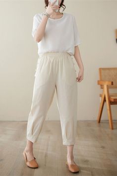 These pants have a lot of wonderful detailing. They exemplify the ever-evolving fashion trends, ensuring that style and comfort go hand in hand. Uncomplicated yet sophisticated, these trousers effortlessly make a statement. ★★ DETAILS 50% linen, 50% cotton Two side pockets Elastic waist dress Tapered Linen Pants Pockets with buttons on both sides Long Linen pants Casual pants Plus size pants Perfect for Spring, Summer,Autumn Dry clean ★★ More pants from Ylistyle: https://etsy.me/3823Kuq ★★ Bespo Summer Ankle-length Linen Cargo Pants, Beige Harem Pants With Side Pockets For Summer, Summer Beige Harem Pants With Side Pockets, Beige High-waisted Harem Pants With Pockets, Beige Ankle-length Harem Pants With Side Pockets, Beige Tapered Leg Cargo Pants For Summer, Ankle-length Beige Harem Pants With Side Pockets, Linen Ankle-length Cargo Pants, High-waisted Linen Cargo Pants For Spring