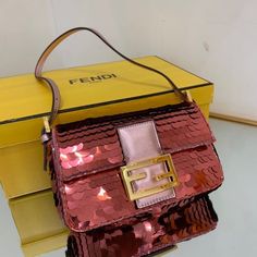 SHOP MORE LUXURY PRODUCTS HERE Description Fendi Mini Baguette 1997 Pink Sequinned Bag For Woman 19.5cm/7.5in 8BS049AISLF1H37 Size: 19.5 x 5 x 11 cm / 7.5 x 2 x 4.5 inch Mini 1997 Baguette bag with all-over pink metallic sequin embroidery, embellished with an FF clasp.This style is a re-release of the first Fendi Baguette, created in 1997, from which it takes its name and the iconic design to wear under the arm.Featuring a front flap, rose-gold leather details and a magnetic clasp. Satin-lined i Luxury Baguette Bag For Shopping, Designer Pink Baguette Bag For Shopping, Pink Baguette Bag With Gold-tone Hardware For Evening, Pink Evening Baguette Bag With Gold-tone Hardware, Luxury Baguette Shoulder Bag For Party, Luxury Baguette Bag For Party, Rectangular Baguette Bag With Gold-tone Hardware For Party, Designer Rectangular Baguette Bag For Party, Party Baguette Bag With Gold-tone Hardware