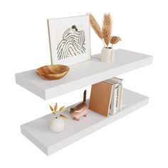 two white shelves with books, vases and other items on top of each shelf