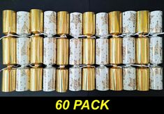 six rolls of gold and white glittered paper with the words 50 pack on it