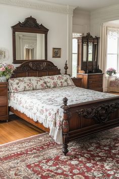 a bedroom with a bed, dressers and mirror in it's center area