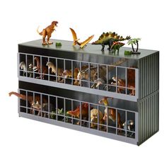 two toy dinosaurs in a metal container with plastic figures on the top and bottom shelves