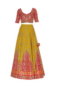 A festive-special and regal lehenga ensemble crafted in raw silk fabric will match your joyous mood so well. It is accentuated with zari gota embroidery and zircon embellishments. The lehenga comes along with an opulent gold gota work blouse. 
Lehenga set
Gold gota embroidery on blouse
Sweetheart neck blouse
Zari threadwork
Sheer dupatta with gota borders - Aza Fashions Regal Lehenga, Embroidery On Blouse, Blouse Sweetheart Neck, Sweetheart Neck Blouse, Gota Embroidery, Sheer Dupatta, Blouse Lehenga, Raw Silk Fabric, Gota Work