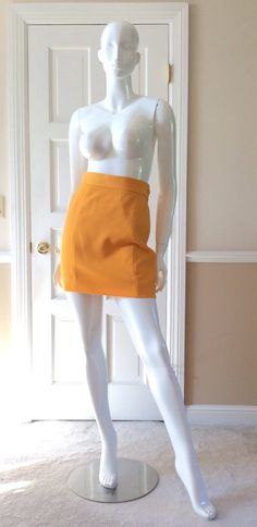 This vintage Moschino skirt is in his iconic taxi cab/school bus yellow. Fully lined in yellow rayon. Side zipper with self button. Front and back shaping seams. Measurements - Waist - 27’Hips - 36”Length - 18” Fitted Retro Style Mini Skirt, Retro High-waist Fitted Mini Skirt, Retro Fitted High Waist Mini Skirt, Retro Fitted High-waist Mini Skirt, Fitted High Waist Retro Mini Skirt, Retro High Waist Fitted Skort, Retro High-waist Fitted Skort, Retro Mini Length Bottoms For School, Retro Fitted Short Skirt