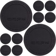 black plastic coasters with the words and numbers on them, all in different sizes