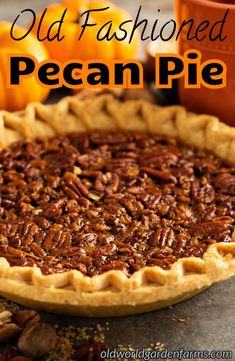 an old fashioned pecan pie on a table with pumpkins in the background and text overlay