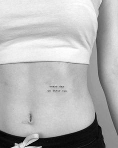 a black and white photo of a woman's stomach with an inscription on it