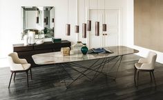 a dining room table with chairs and a book on it