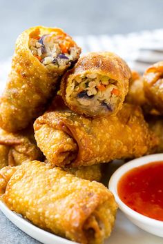 some fried food on a plate with dipping sauce