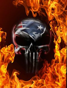 a fire skull with the new england football team on it's face is surrounded by flames