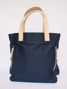 Navy Waxed Canvas Tote Bag by Notebooks & Honey – notebooks & honey Reversible Coated Canvas Bag For Everyday Use, Reversible Coated Canvas Everyday Bag, Everyday Reversible Coated Canvas Bag, Cotton Travel Bags With Twill Lining, Waxed Canvas Bag With Canvas Lining For On-the-go, Navy Cotton Canvas Bag For Everyday, Navy Cotton Shoulder Bag For Everyday Use, Everyday Navy Cotton Canvas Bag, Waxed Canvas Bag For On-the-go