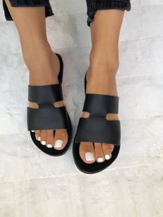 Black leather Slides that are made from 100% Genuine leather in a unique design. Find them only at Christina Christi MATERIALS - 100% Greek Leather - 100% Handmade Sandals. - Each pair of this leather sandals is unique. Sometimes has some small natural marks or light color irregularities. These are absolutely physical, as no chemicals are used. - The sole is lightweight and handmade with of high-durability rubber. You can enjoy miles of safety walk and sandal's soles will be always on shape. SIZ Summer Leather Sandals, Dream Shoe, Shoes Photography, Handmade Sandals, Womens Summer Shoes, Leather Slide Sandals, Leather Sandals Women, Black Leather Sandals, Fashion Sandals