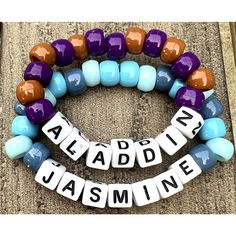 two bracelets with words that spell out the word aladdy jasmine