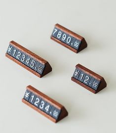 four small wooden numbers are placed next to each other