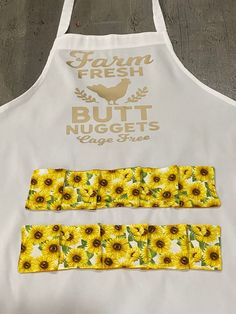 an apron with sunflowers on it and the words farm fresh but nuggets cage free