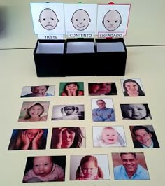 a table topped with lots of different pictures and boxes filled with photos next to each other