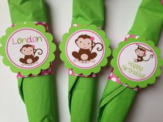 three green napkins with monkeys on them